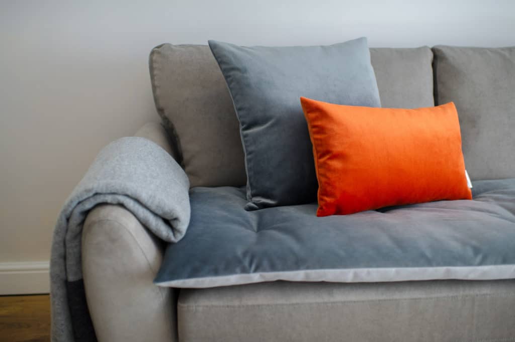 Grey and orange velvet scatter cushions