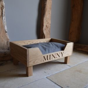 handmade and hand-carved wooden dog bed in oak