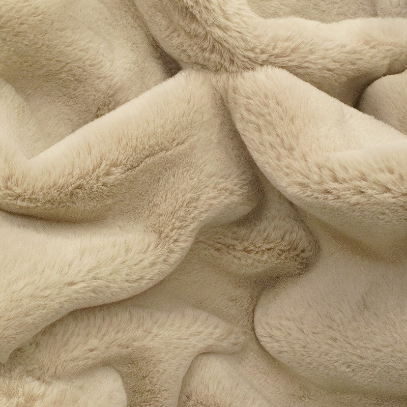 Close up of the short, dense Chelsea Sandstone faux fur in pale sand beige